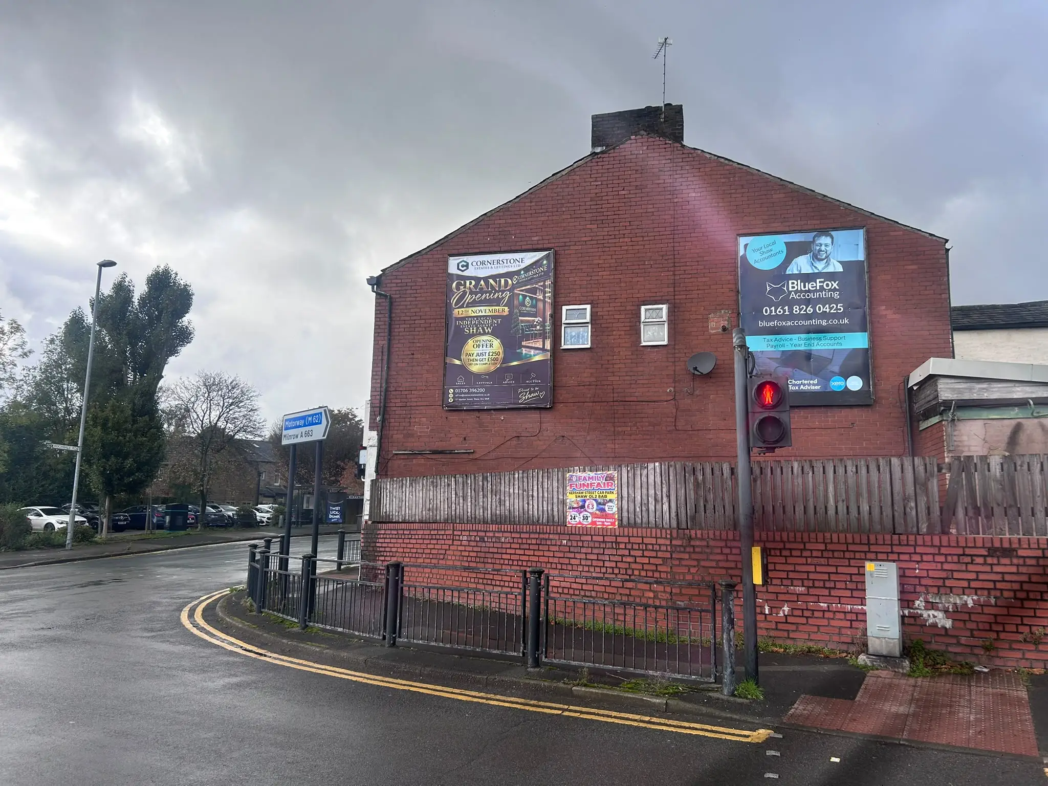 Building-mounted billboard advertising on Rochdale Road, Shaw, by Banner Palace Printing   Copy alt text